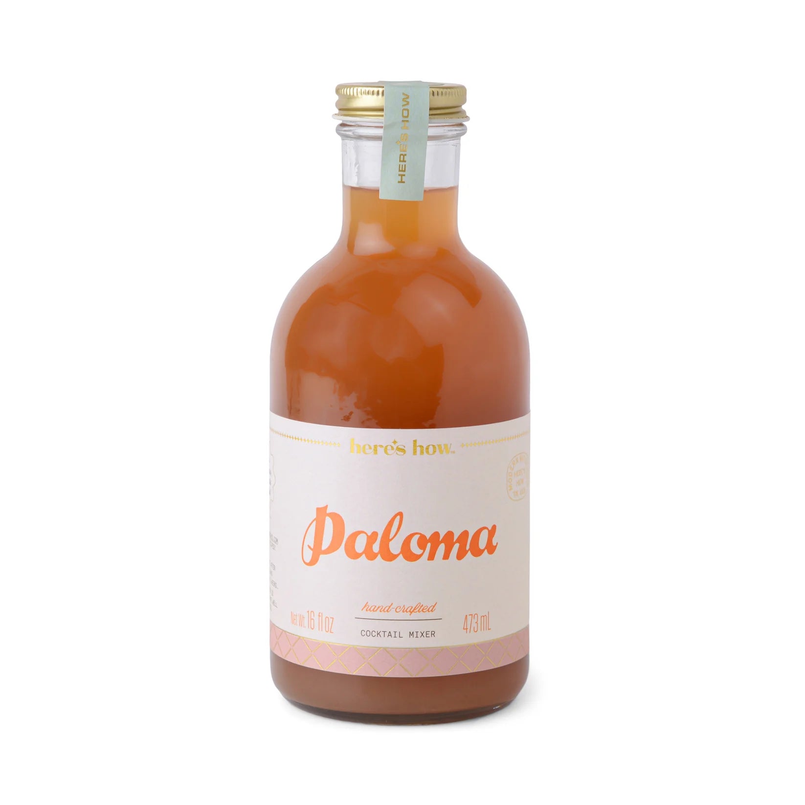 A bottle of pre-made Paloma cocktail mixer.
