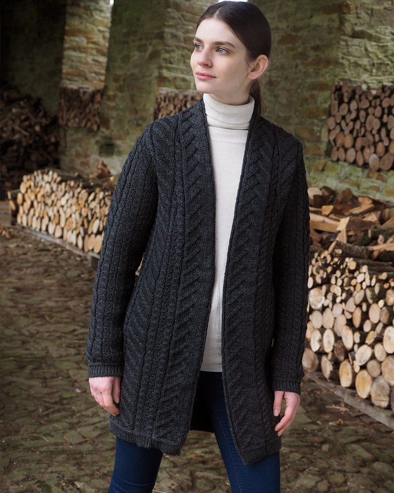 Model wearing long charcoal Aran cardigan