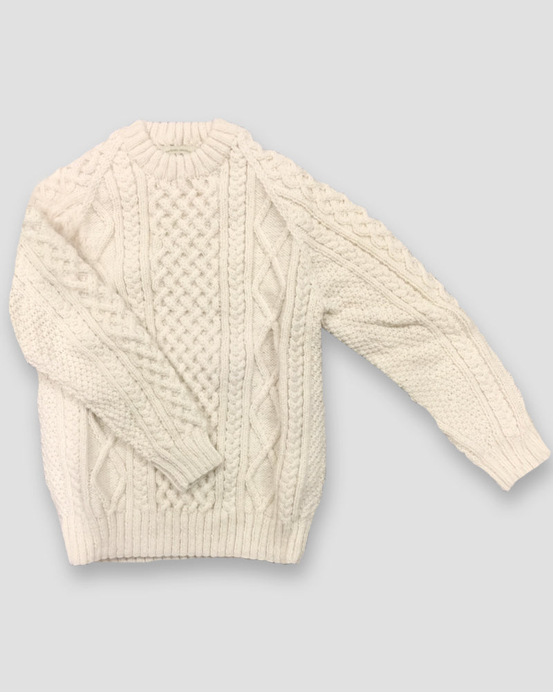 Front image of a traditional Aran sweater made from 100% Irish wool
