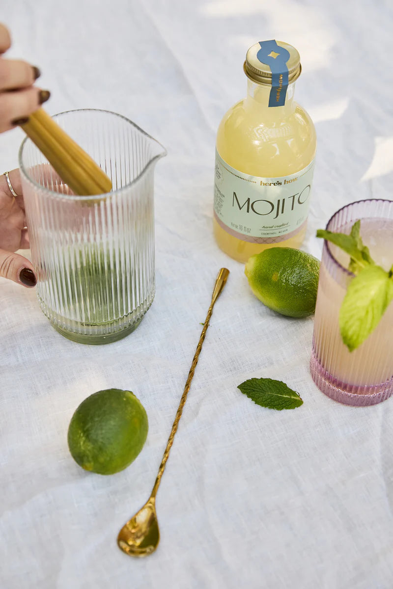 Ingredients to make the perfect mojito - lime, mint and the Here's How mojito mix.