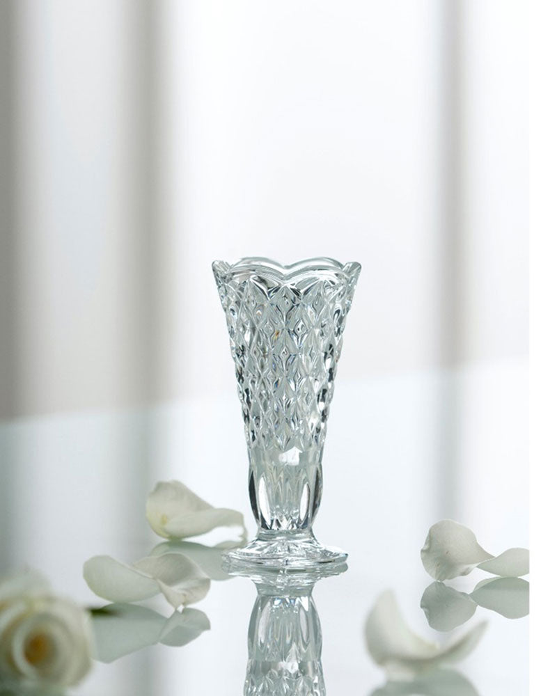 Galway Crystal Ashford Bud Vase placed on a desk surrounded by flowers