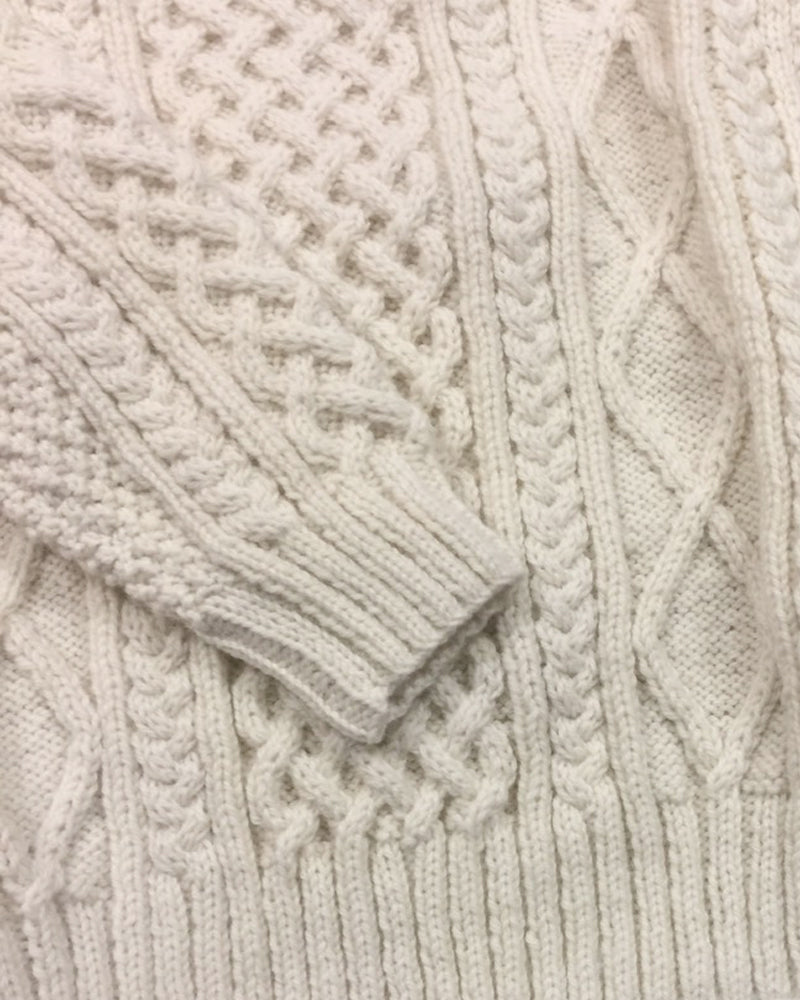 Close-up image of a traditional Aran sweater made from 100% Irish wool