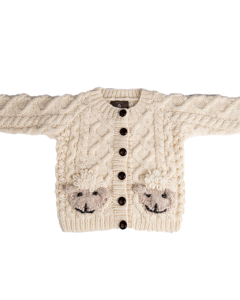 Product shot of Aran Woollen Mills handknit wool cardigan sweater with sheep pockets