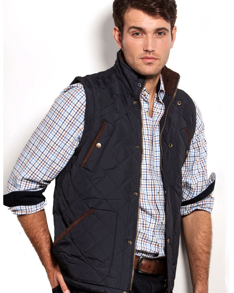 Model wearing Vedoneire men's quilted gilet in navy